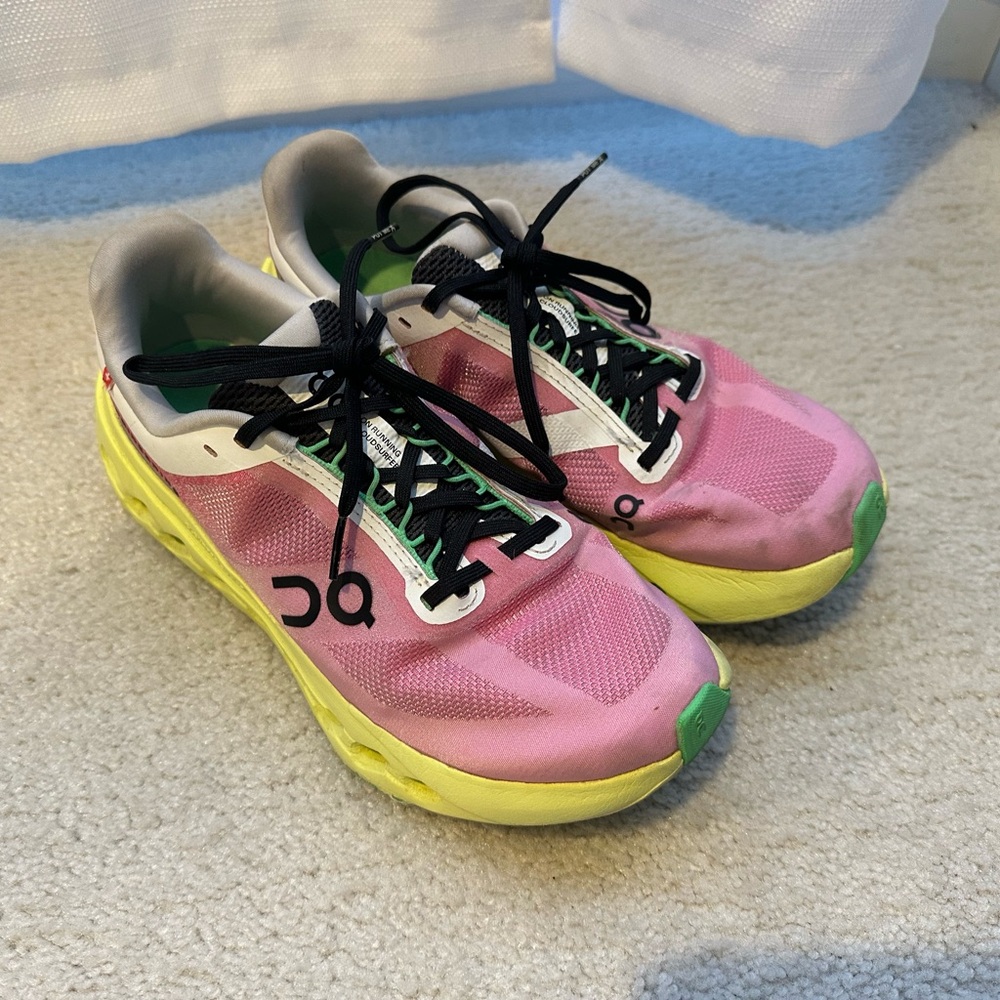 On Running Pink and Yellow Athletic Shoes